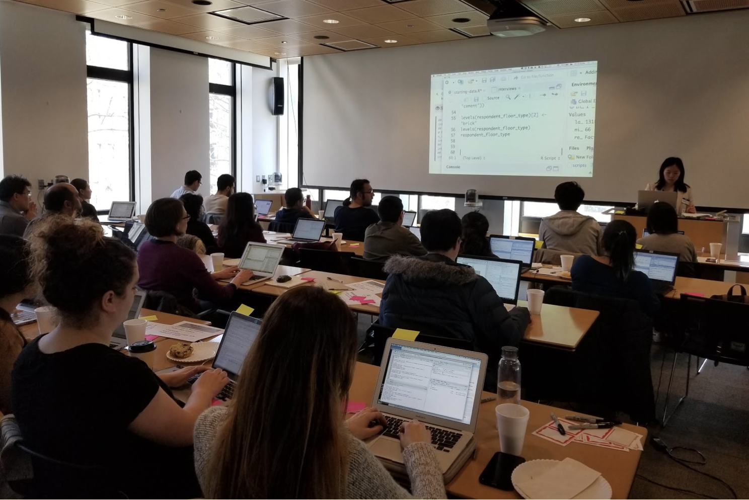 Around 25 attendees attend the first R for Social Scientists workshop in April 2019 at the University of Chicago, taught by Angela Li